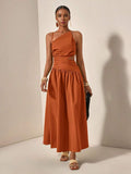 Rust one-shoulder maxi dress with side cutout and gathered skirt