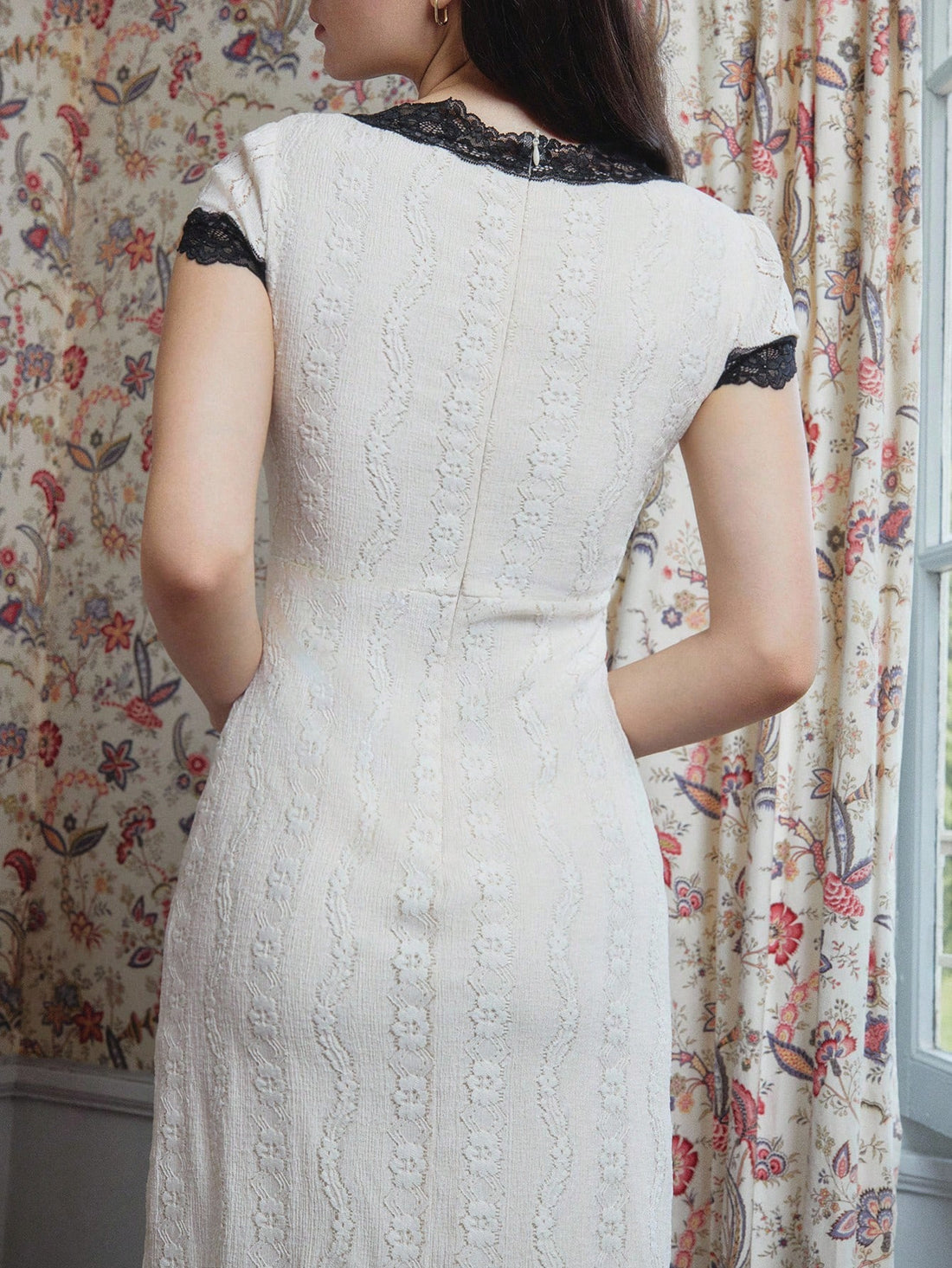 Elevate your wardrobe with this stunning white lace midi dress that strikes the perfect balance between sophistication and fun! The delicate lace detailing creates an airy, romantic vibe, while the bold black V-neckline adds a modern twist that keeps things interesting. Midi length offers versatile styling—dress it up for special occasions or keep it casual for everyday wear. The crisp white and black color combo works beautifully through autumn and winter, making it an ideal choice for teachers and anyone 