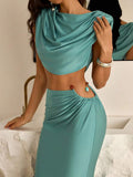 Turquoise ruched crop top with fitted maxi skirt and beaded waist accents
