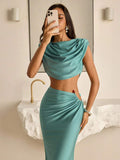 Teal satin-like crop top and ruched floor-length skirt
