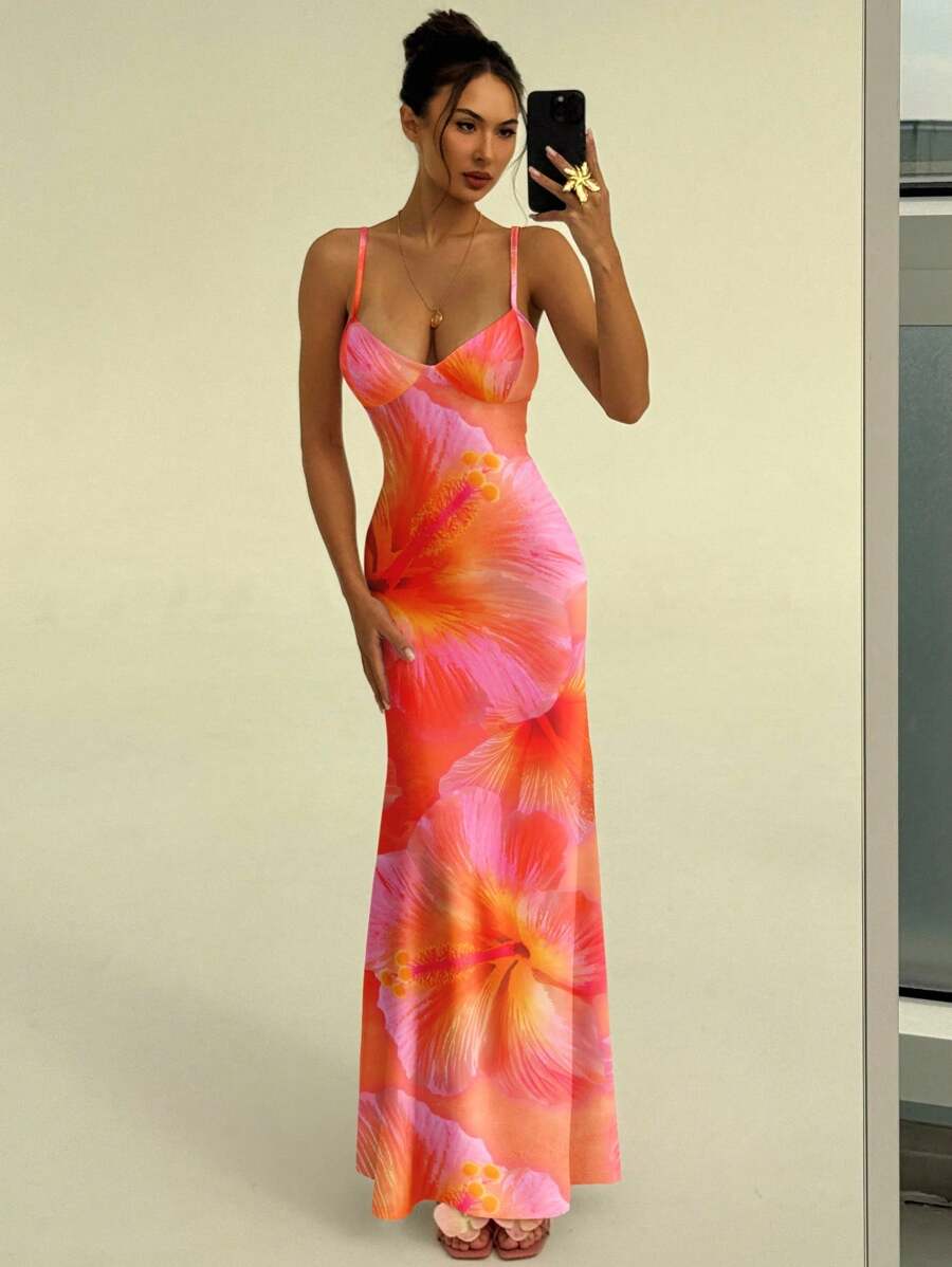 Mirror selfie of orange floral maxi dress with sweetheart neckline and pink heels