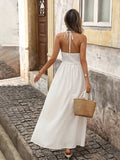 Back view of white boho halter maxi dress with open back and halter tie
