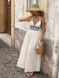 Front view of white boho halter maxi dress with geometric high waist and flared skirt