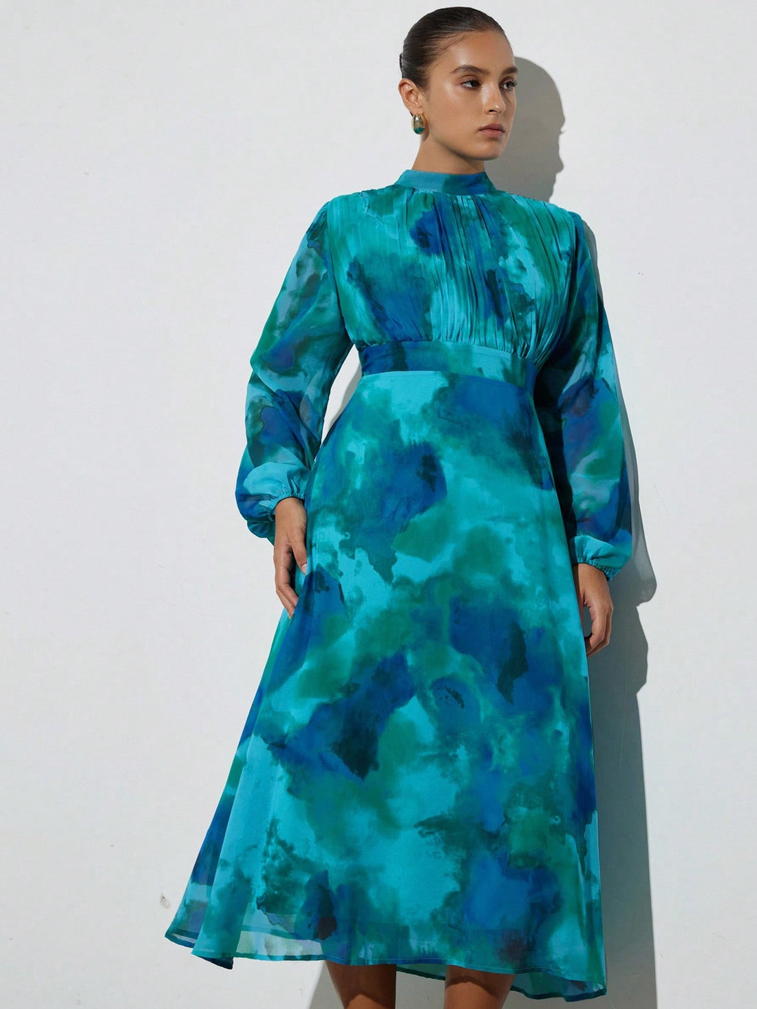 Step out in style with this Elegant Plus Size Tie-Dye Long Sleeve Dress, designed to flatter every curve with its ruched waist. Perfect for commuting or casual outings, its vibrant tie-dye pattern adds a fun twist to your wardrobe while the long sleeves keep you cozy. Effortlessly chic and comfortable, this dress is your new go-to for a playful yet polished look.