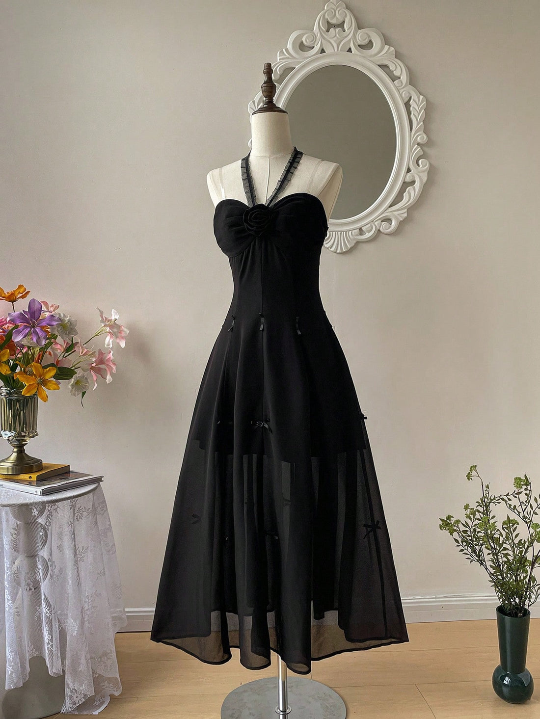 Step out in style with this Elegant Black 3D Floral Maxi Dress, designed to turn heads wherever you go. The delicate floral textures add a charming depth, while the playful bow and ruffled ties bring a flirty touch. Whether you're on vacation, heading to a date, or dancing at a festival, this dress combines comfort and elegance for all your fun-filled moments.
