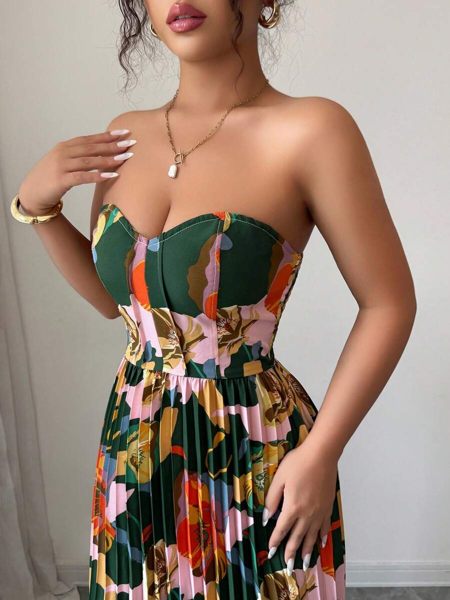Step into romance with this stunning floral print bustier dress that's equal parts elegant and enchanting. The fitted bodice hugs your curves beautifully while the pleated A-line skirt flows with effortless grace, creating a silhouette that turns heads. Delicate florals dance across the fabric, bringing a touch of garden-inspired charm to any occasion. Perfect for date nights, garden parties, or whenever you want to feel absolutely fabulous. This dress proves that timeless style never goes out of fashion.