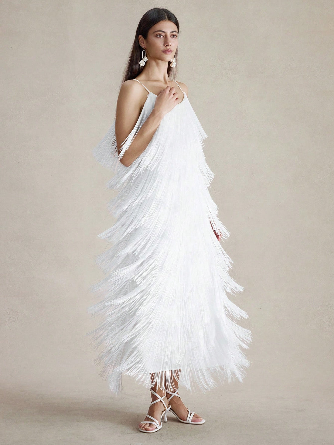 Step into the spotlight with this playful sleeveless dress featuring layered fringe that dances with every move. Its solid color keeps things chic and versatile, making it your go-to for summer parties, cozy fall dates, or sunny vacations. Lightweight and fun, it’s designed to keep you comfortable while turning heads wherever you go.