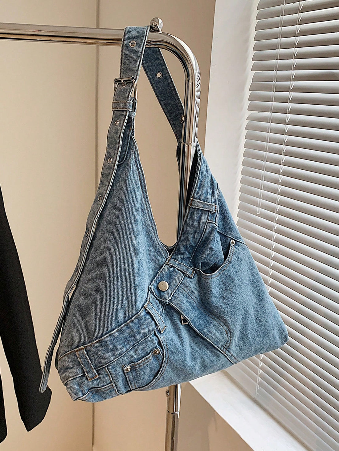 Add a splash of fun to your daily look with this Chic Casual Washed Jeans Crossbody Bag. Crafted from stylish washed denim, it blends casual cool with roomy practicality, perfect for holding all your commuting essentials. Its hobo shape drapes comfortably on your shoulder, making busy days feel a little lighter and a lot more playful. Whether you're running errands or meeting friends, this bag is your new go-to for effortless style and convenience.