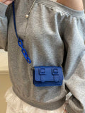 Lifestyle detail of mini color block crossbody bag with polished acrylic accent