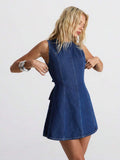 Three-quarter front view of dark indigo backless denim mini dress with fitted princess seams