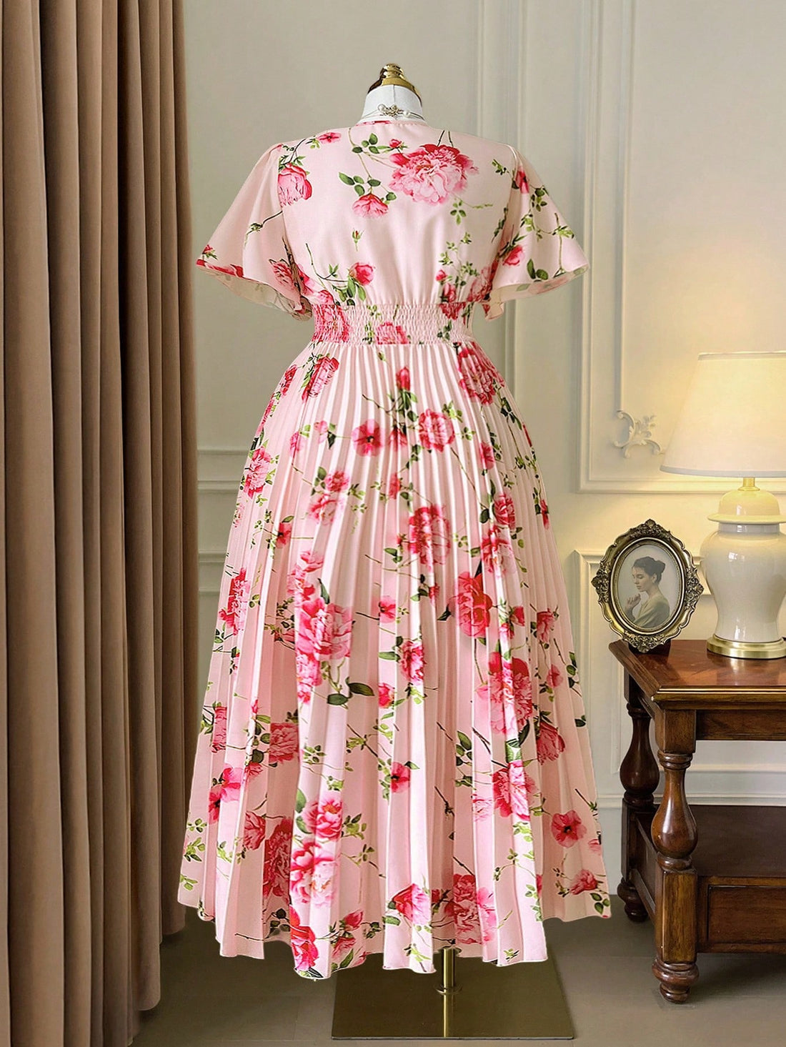 Step into effortless charm with this Elegant Plus Size V-Neck Pleated Maxi Dress. Featuring a flattering V-neck and breezy short sleeves, its delicate floral print and flowing pleats add a touch of whimsy to your look. Perfect for sunny days or garden parties, this dress combines comfort and style in a playful, flattering way.