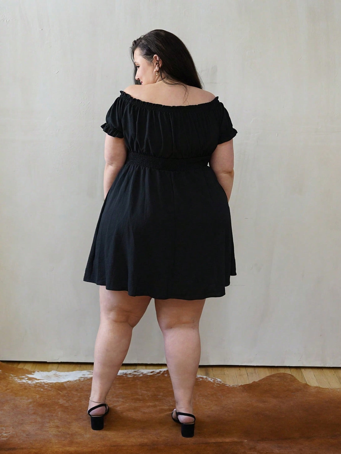Slip into effortless elegance with this stunning off-shoulder black dress designed for curves and confidence. The cinched waist creates a flattering silhouette while the breathable fabric keeps you cool and comfortable all day long. Whether you're lounging by the pool on vacation or running errands around town, this versatile piece transitions seamlessly from day to night. The classic black hue pairs with everything in your wardrobe, making it a go-to favorite for any occasion. Embrace your style and feel f