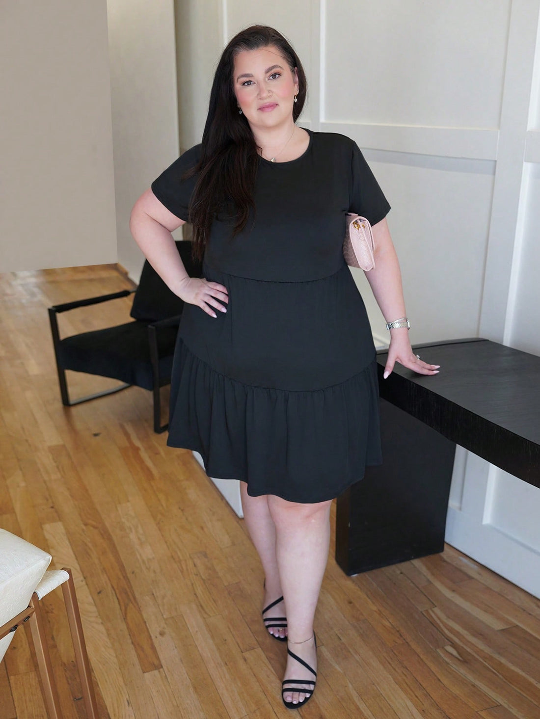 Designed with pear-shaped figures in mind, this loose-fit black t-shirt dress from Truni Sometimesglam offers effortless comfort without compromising style. The relaxed silhouette skims over curves while the classic black hue pairs with everything in your wardrobe. Perfect for warm-weather days when you want to look put-together without the fuss. Throw it on, feel fabulous, and let the dress do the work—because fashion should be fun, not complicated.