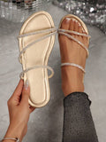 Gold metallic flat slide sandals with crystal multi straps front view