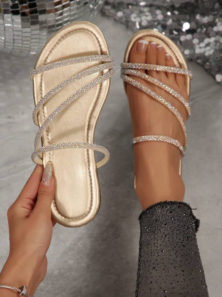 Champagne gold crystal embellished flat sandals with black outsole