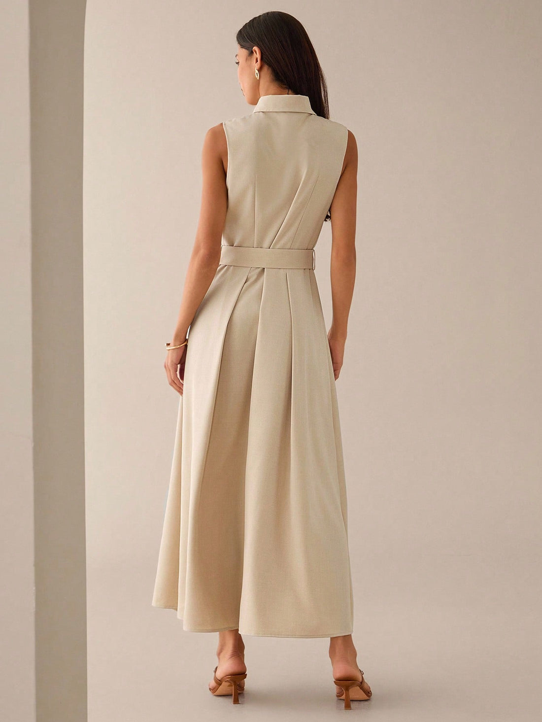 Step out in style with this elegant sleeveless embroidered shirt dress, perfect for both urban adventures and romantic evenings. Its delicate embroidery adds a touch of charm, while the sleeveless design keeps you cool and comfortable all day. Whether you're strolling through the city or enjoying a date night, this dress effortlessly blends sophistication with playful ease.