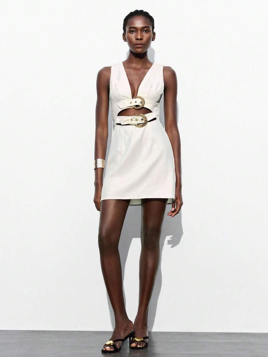 Turn heads effortlessly in this chic vintage mini dress featuring a playful hollow waist and delicate eyelet detailing. Its solid color makes it a versatile pick for both lively parties and stylish business casual occasions. Flirty yet sophisticated, this dress adds a dash of charm to your wardrobe with a fun twist on classic elegance.