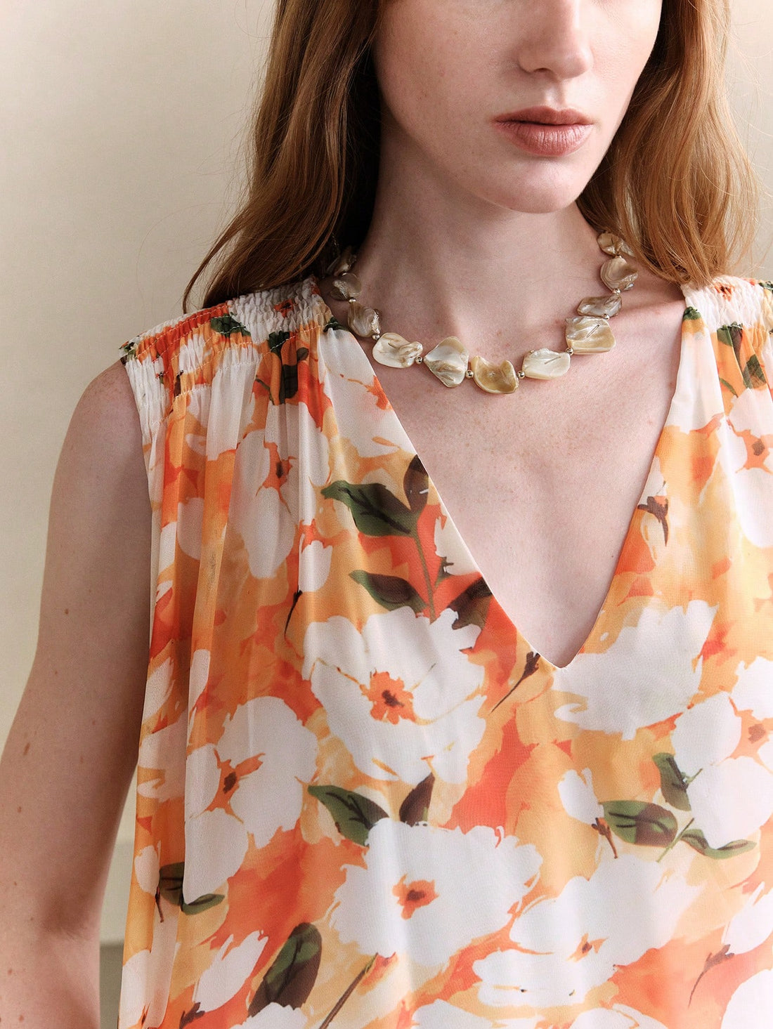 Step into sunshine and smiles with this Chic Floral Chiffon Maxi Dress. Its breezy chiffon fabric and flattering V-neck sleeveless design keep you cool and stylish, perfect for summer vacations or dancing the night away at weddings. The flowing A-line silhouette adds a touch of effortless elegance, making every moment feel like a celebration.