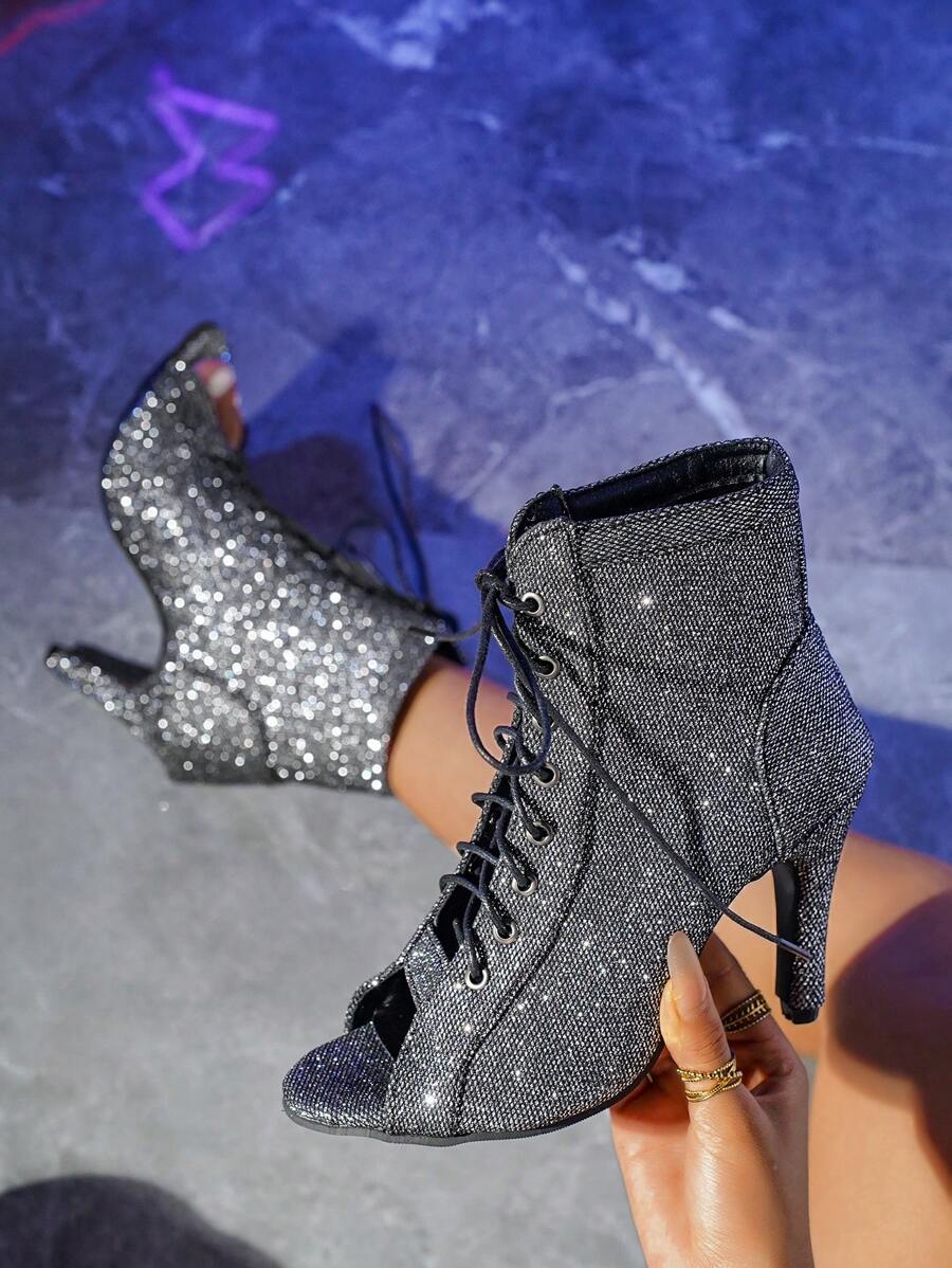 Step out in style with these playful high heels featuring a chic peep toe and trendy criss-cross straps. Crafted with breathable mesh, these dance boots keep your feet comfortable while you move with confidence. Perfect for adding a flirty touch to any outfit, they blend fashion and comfort effortlessly.