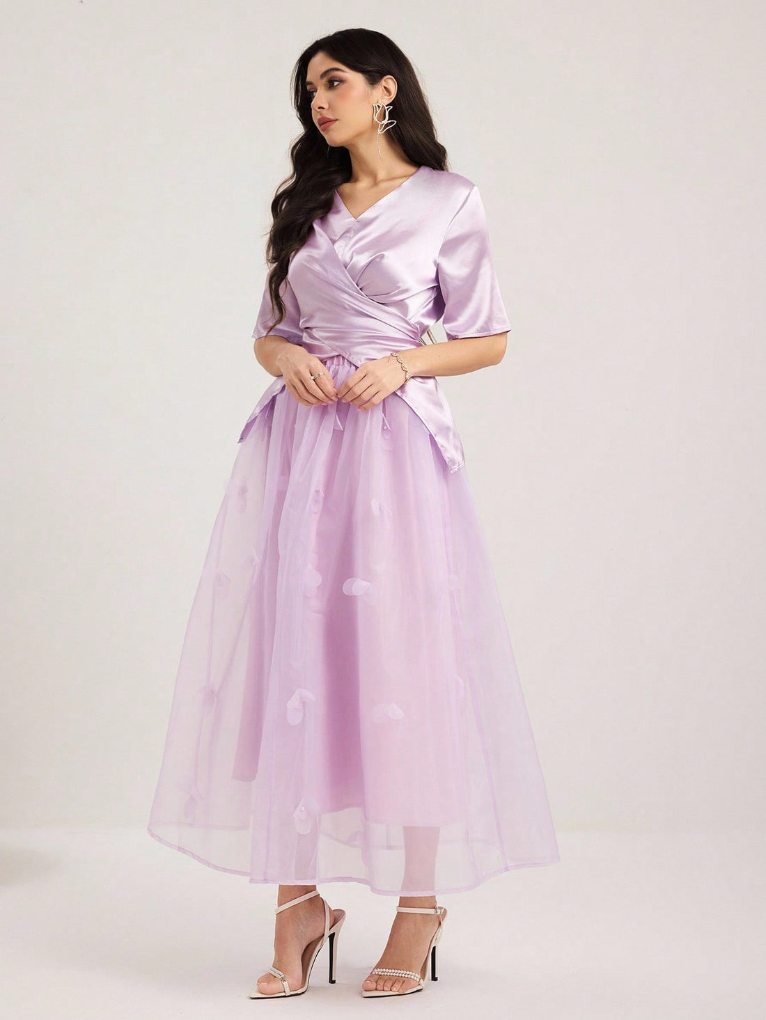 Elevate your wardrobe with this stunning lilac two-piece set that's equal parts chic and fun. The cross wrap blouse features flattering draping that cinches at just the right spots, while the coordinating mini skirt offers a flirty silhouette perfect for date nights or weekend adventures. The soft lilac hue brings a fresh, feminine touch to any occasion. Mix and match with your favorite accessories to create endless outfit possibilities. Comfort meets style in this must-have set that'll have you feeling con