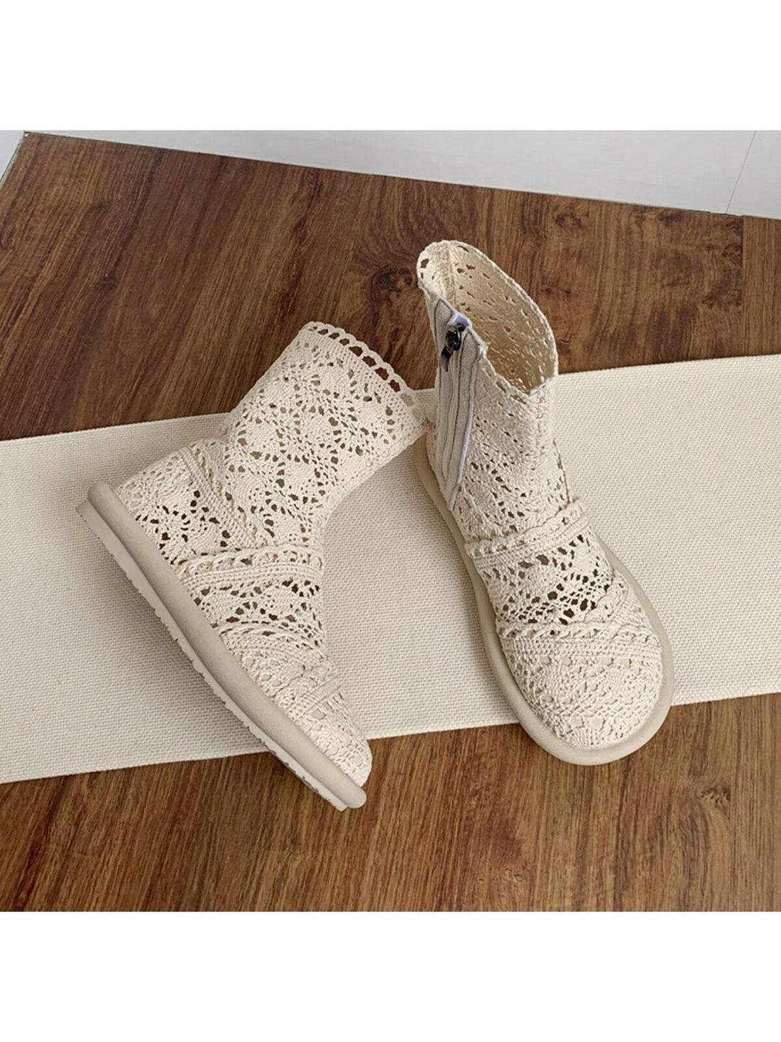 Step out in style with these playful white lace ankle boots! Featuring a comfy flat heel and a round toe, they’re perfect for casual days when you want to add a touch of charm. The convenient zipper closure makes slipping them on a breeze, while the delicate lace design keeps your look fresh and fun. Perfect for pairing with your favorite jeans or dresses, these boots bring a flirty twist to everyday footwear.