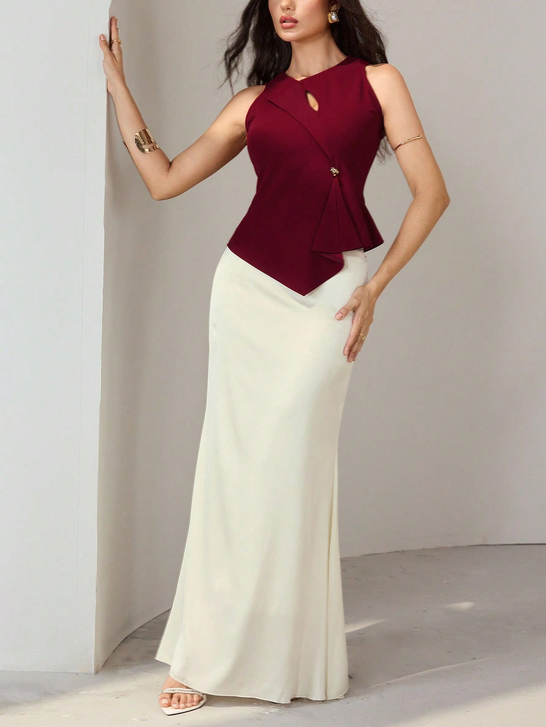 Elevate your everyday style with this chic 2-piece set that proves minimalism can be anything but boring. The abstract asymmetrical hem top adds an unexpected twist to classic sophistication, while the sleek pencil skirt keeps things polished and put-together. Perfect for transitioning from office to evening plans, this dynamic duo works hard to make you look effortlessly stylish. Mix, match, or wear together—either way, you're winning the fashion game.