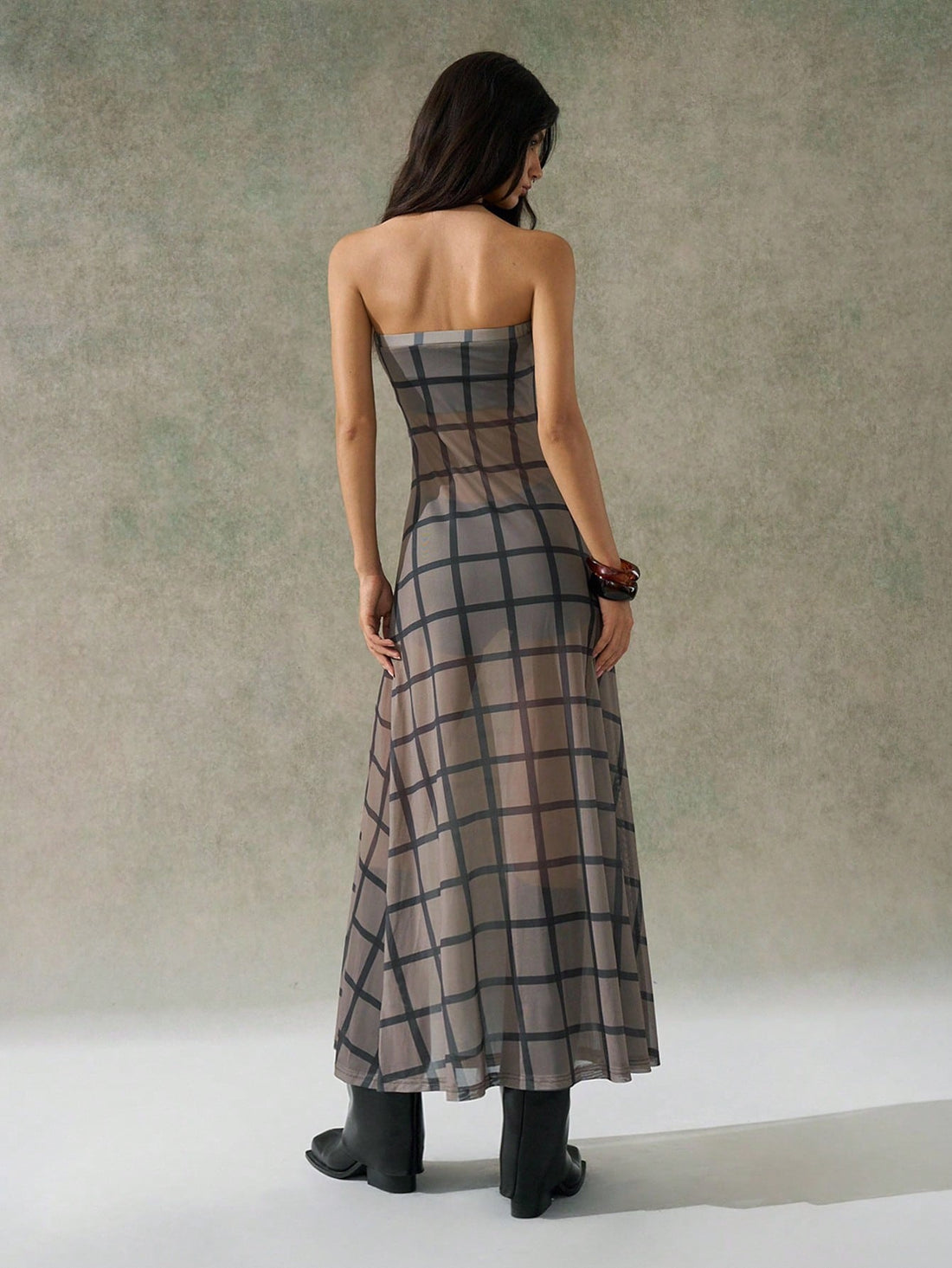 Step into fall with this playful Y2K-inspired checkered strapless dress, designed to turn heads at homecoming and back-to-school events. Its bold pattern and flattering strapless cut make it a fun, stylish choice for those who love to mix retro vibes with modern flair. Perfect for dancing the night away or making a statement in the classroom!