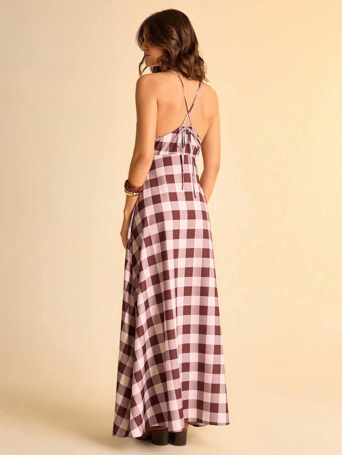 Step into sunny days with this Chic Brown and White Plaid V-Neck Sleeveless Dress. The playful tie knot detail adds a flirty twist, while its breezy sleeveless design keeps you cool and comfy. Perfect for effortless summer vibes, this dress blends classic plaid with a fun, fresh silhouette you'll want to wear everywhere.