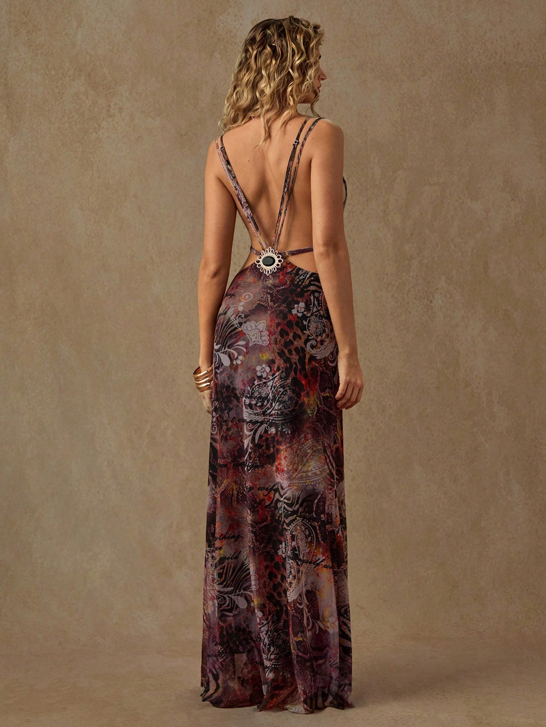 Step back in time with this show-stopping Y2K animal print maxi dress that screams early 2000s glamour. Featuring a daring hollow back design and sparkling rhinestone embellishments, this piece transforms any summer occasion into a fashion moment. The bold animal print commands attention while the flowing maxi silhouette keeps things effortlessly chic. Perfect for those who dare to make a statement—whether you're hitting the beach, attending a festival, or turning heads at a night out. Vintage vibes meet mo