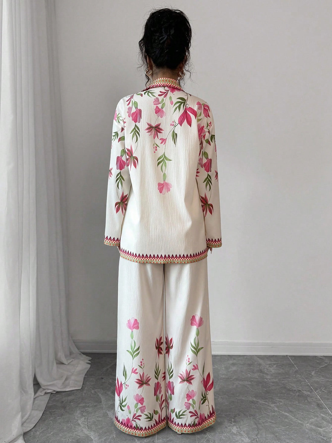 Elevate your fall wardrobe with this vibrant two-piece set that's equal parts fun and fabulous. The long sleeve shirt features eye-catching digital prints in a gorgeous multi-color palette that instantly lifts any outfit, while the coordinating pants offer a comfortable, flattering fit. Perfect for layering on cooler days or standing out at casual gatherings, this set brings effortless style to your everyday rotation. Mix, match, or wear together—either way, you're guaranteed to turn heads this season.