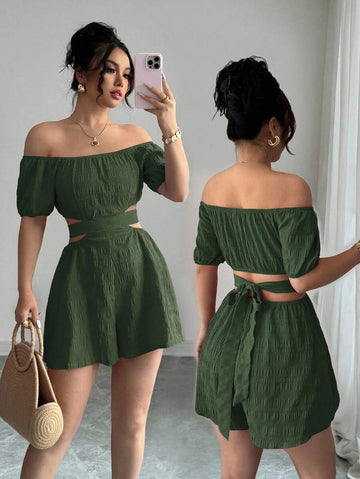 Split front and rear views of green off-shoulder romper showing open waist and tied bow