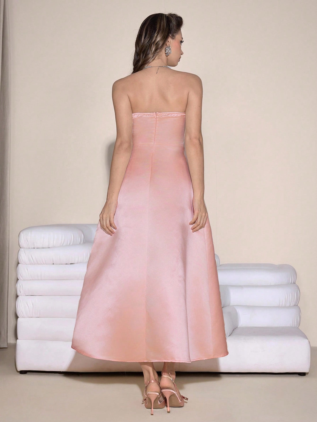 Step into the spotlight in this show-stopping ball gown that's practically begging for a grand entrance! Adorned with shimmering rhinestones and a fabulous bow detail at the bandeau neckline, this dress transforms you into the belle of the ball. Perfect for graduations, proms, or any occasion where you want to feel absolutely magical, the luxurious silhouette flatters every figure while the glittering embellishments catch the light with every twirl. Get ready to turn heads and collect compliments all night 