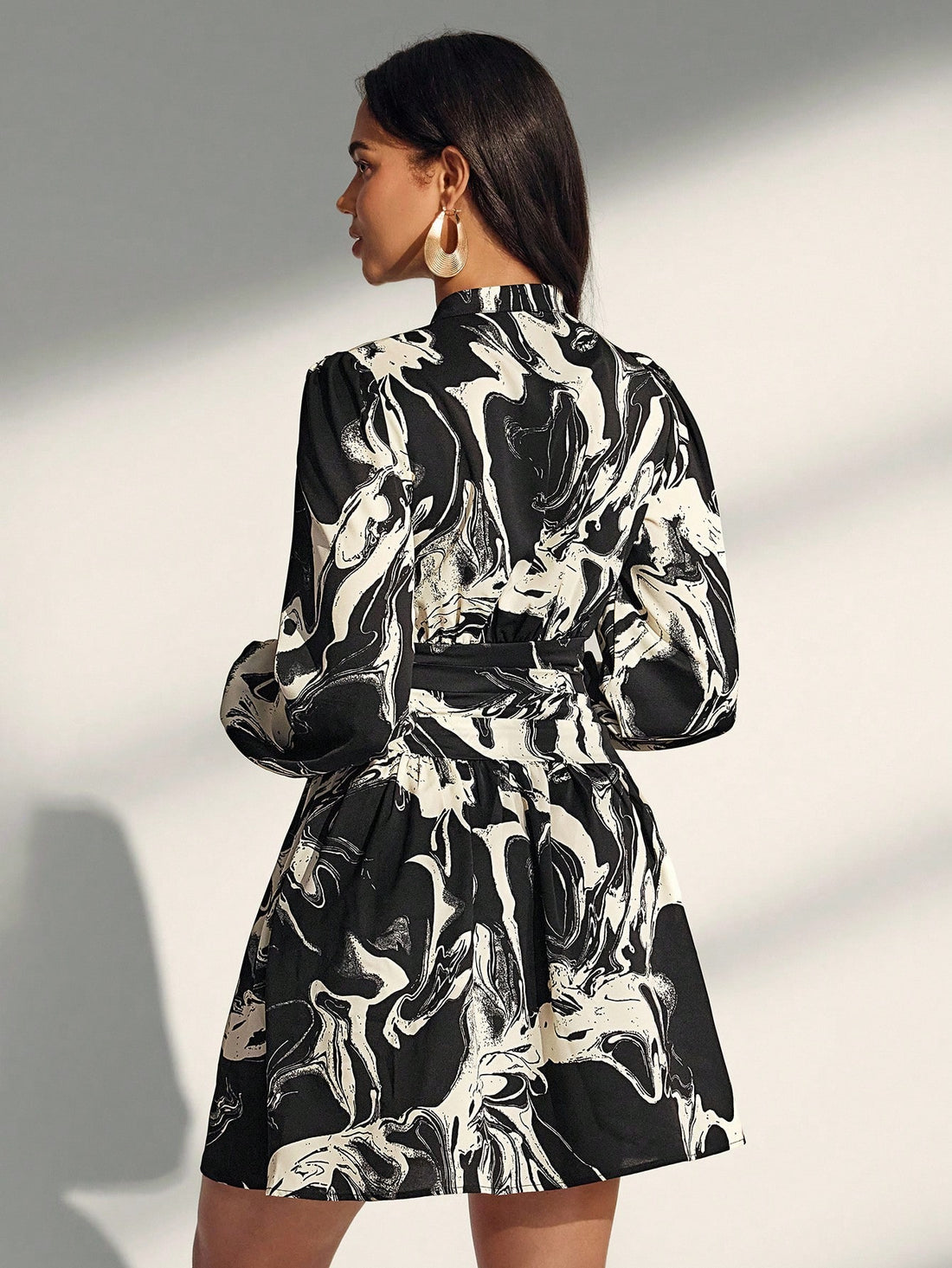 Embrace effortless sophistication with this striking asymmetrical printed dress that's perfect for transitioning into fall. The playful print adds personality while the minimalist silhouette keeps things chic and modern. Its unique hemline creates an eye-catching look that works equally well for casual outings or elevated occasions. Lightweight and flattering, this dress is your go-to piece for looking put-together without trying too hard. Style it with sneakers for a relaxed vibe or dress it up with heels 