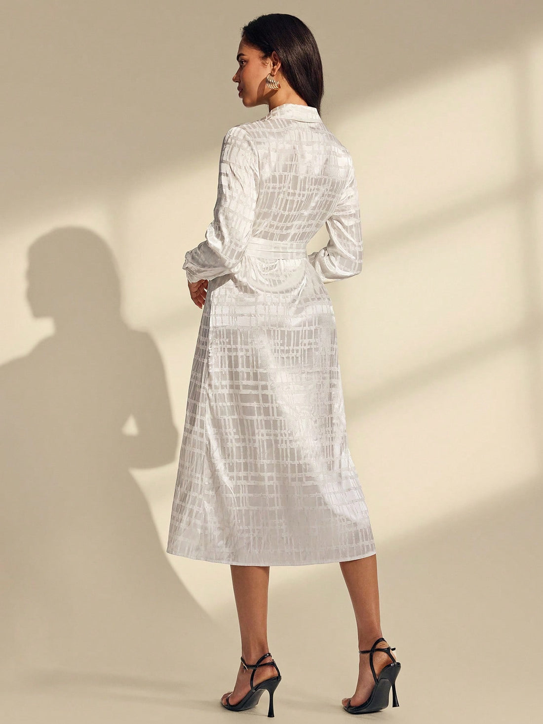 Elevate your seasonal wardrobe with this stunning white geometric jacquard dress! Featuring intricate patterned detailing and cozy long sleeves, it's the ultimate go-to piece for breezy spring days and crisp autumn afternoons. The relaxed silhouette keeps things effortlessly chic while the timeless white base pairs beautifully with everything in your closet. Whether you're running errands or meeting friends for coffee, this dress strikes the perfect balance between comfortable and put-together. A versatile 