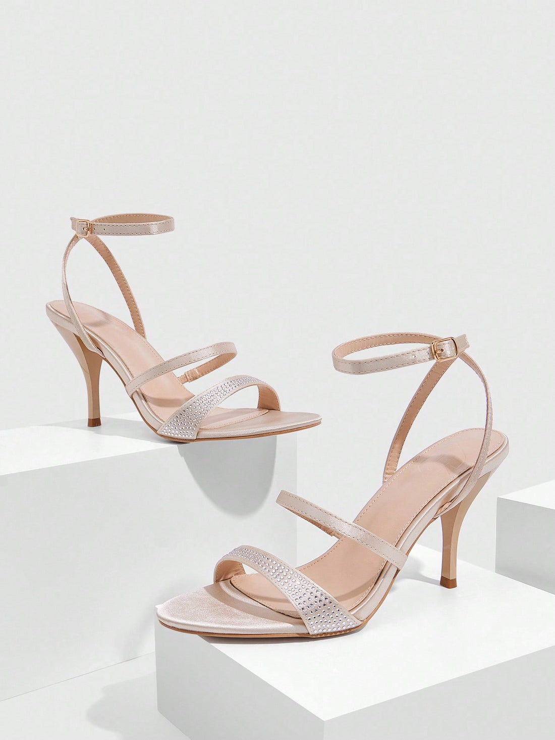 Step into the spotlight with these dazzling gold high heel sandals that turn heads wherever you go. Adorned with shimmering rhinestone embellishments, they're the perfect blend of elegance and eye-catching glamour. Whether you're heading to a special event or want to elevate your everyday style, these sandals deliver that luxe feel without the fuss. Slip them on and let your feet do the talking—because sometimes the best accessory is confidence wrapped in sparkle.