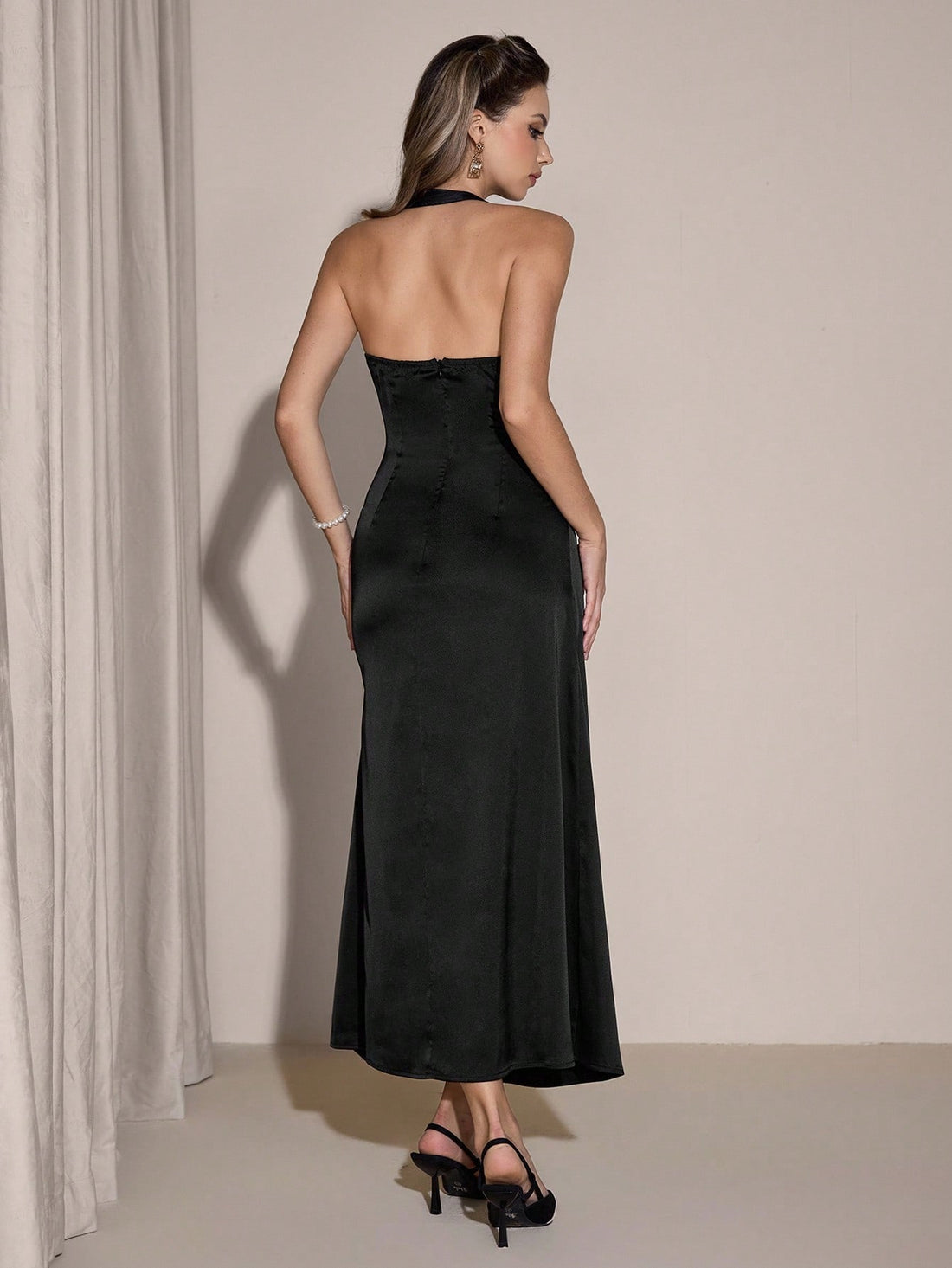 Effortless elegance meets everyday wear with this sleek sleeveless dress. The timeless solid color and graceful pleated detailing create a flattering silhouette that transitions seamlessly from office to evening plans. Cut to a versatile mid-length, it's the perfect canvas for styling with your favorite accessories. Whether you're dressing it up with heels or keeping it casual with sneakers, this chic piece proves that simple sophistication never goes out of style.