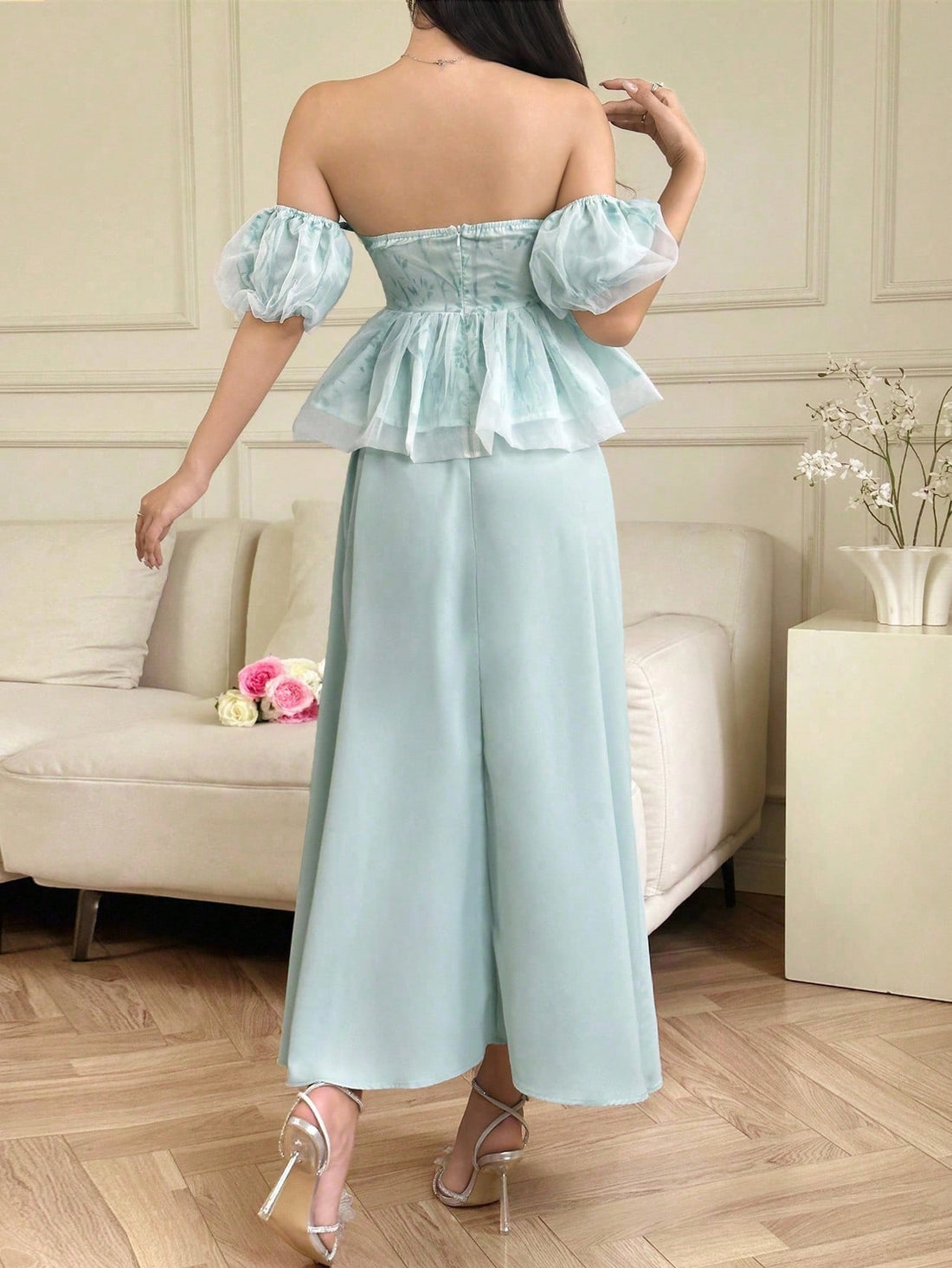 Elevate your wardrobe with this charming two-piece set that's equal parts sophisticated and fun. The off-shoulder top features delicate ruffles and a gorgeous plant print that brings nature-inspired elegance to your everyday style. Pair it with the flowing midi skirt for a complete look that transitions seamlessly from brunch to evening outings. Perfect for anyone who loves botanical vibes and effortless femininity. This set is your go-to for making a graceful impression without trying too hard.