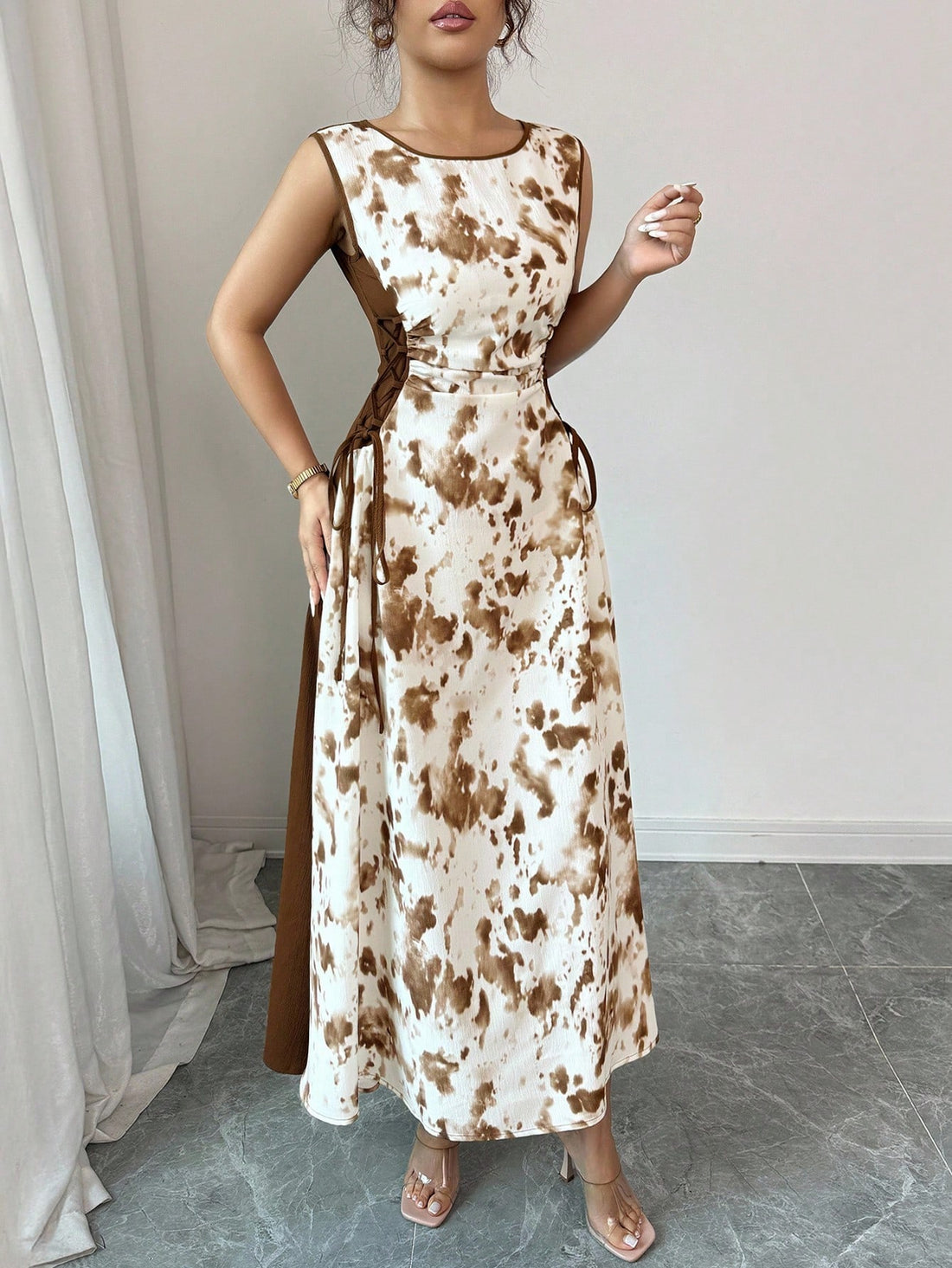 Step into effortless style with this Chic Tie Waist Sleeveless Dress, featuring a dreamy soft-focus print that adds a touch of whimsy to your look. The adjustable tie waist lets you flaunt your silhouette just right, while the sleeveless cut keeps things cool and breezy. Perfect for sunny days or casual nights out, this dress combines comfort with a playful flair that’s sure to turn heads.