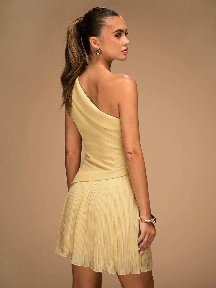 Back view pale yellow one-shoulder mini dress with pleated skirt