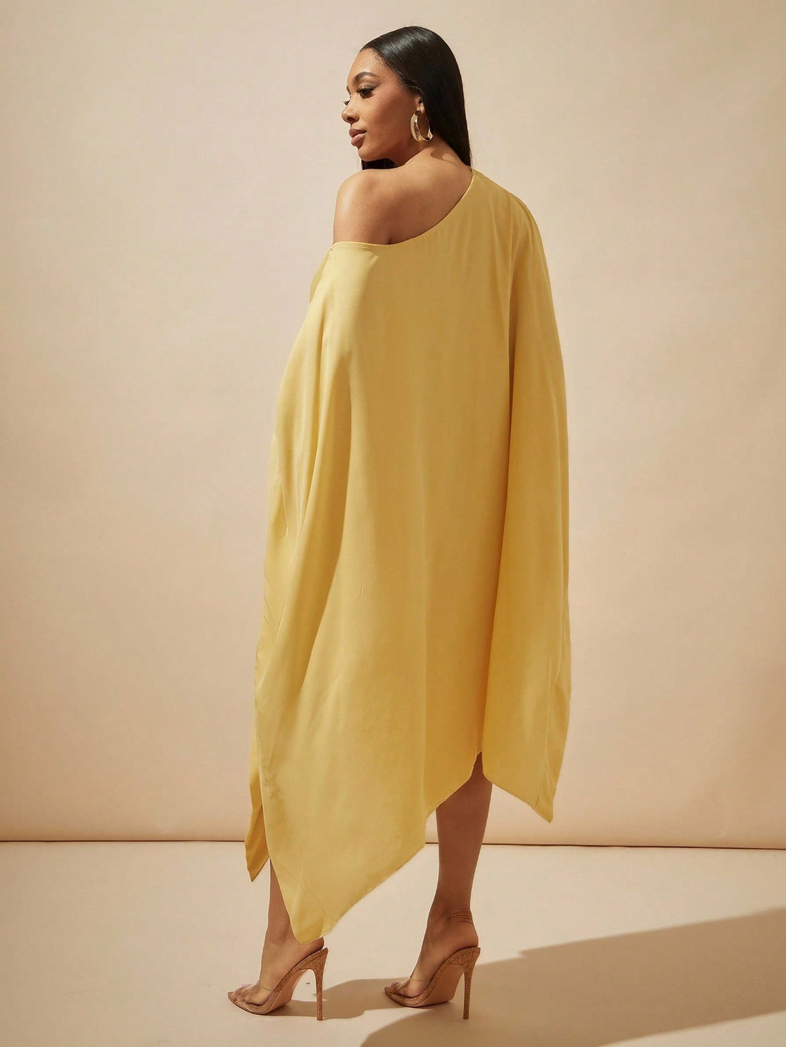 Step into the spotlight with this playful yellow batwing dress crafted from sheer chiffon. Its flowing ruffles add a flirty touch, perfect for turning heads on date nights or weddings. Lightweight and breezy, it moves with you, making every moment feel effortlessly elegant and fun.