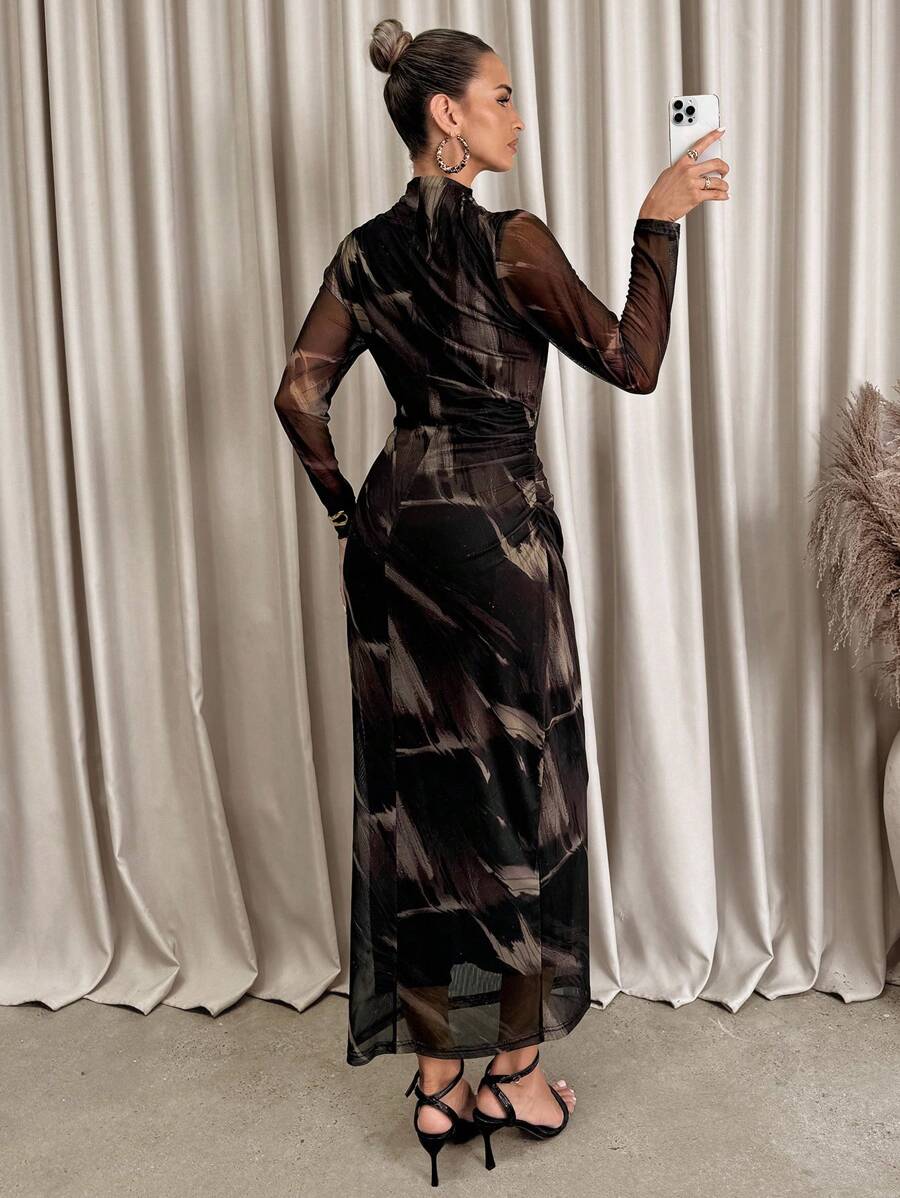 Turn heads with this Elegant Floral Print Ruched Bodycon Dress, designed to hug your curves and highlight your style. The playful ruched detailing adds texture, while the asymmetric hem brings a fun twist to a classic silhouette. Perfect for garden parties or a night out, this dress combines comfort and charm effortlessly. Embrace your feminine side with a floral print that blooms wherever you go!