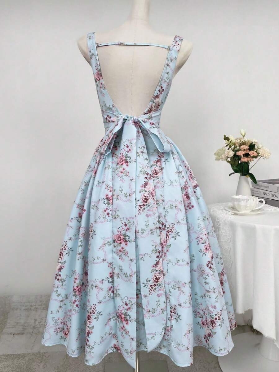 TwTurn heads this season in our stunning floral midi dress, where romance meets modern elegance. The daring backless silhouette paired with a charming bowknot detail creates an unforgettable look that's perfect for summer getaways, garden parties, or any special moment worth celebrating. Flowing fabric drapes beautifully, offering comfort without compromising on style. Whether you're dancing under the stars or enjoying brunch with friends, this dress brings that effortless, sophisticated vibe that makes you