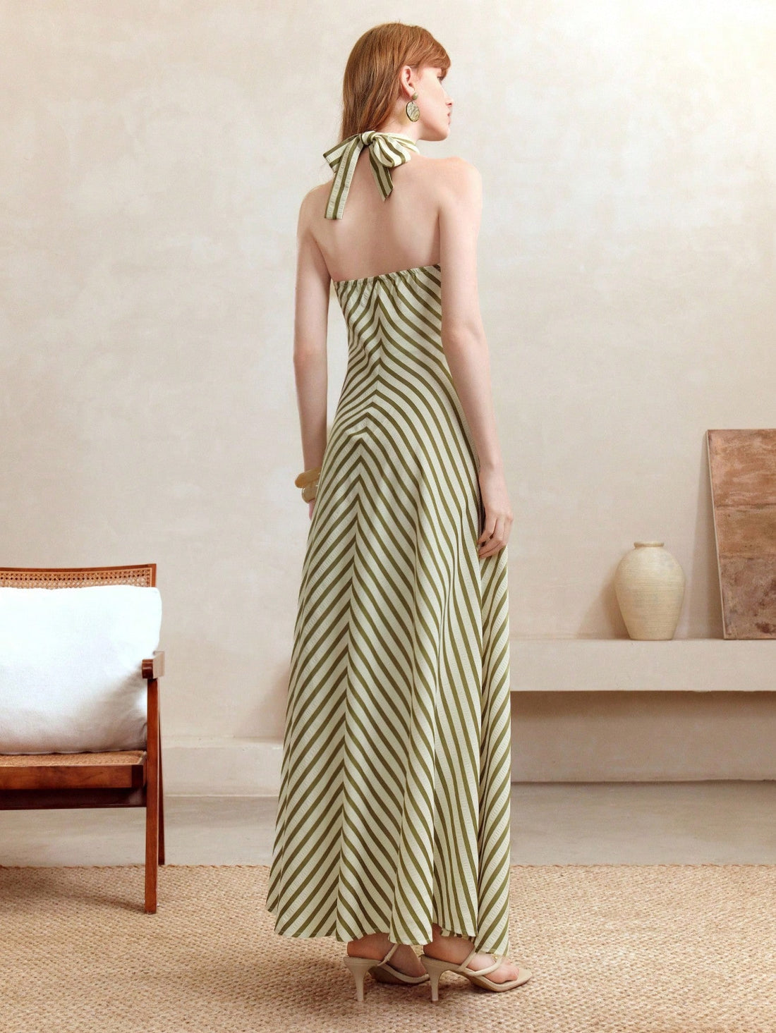 Turn heads wherever you go with this Elegant Backless Halter Neck Striped Dress. Designed to keep you cool and confident, its playful stripes and daring backless cut make it the ideal choice for holidays or any special occasion. Effortlessly stylish and flirty, this dress is your new go-to for stealing the spotlight with ease.