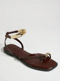 Side view of chocolate brown toe-post sandals with square footbed and ankle strap