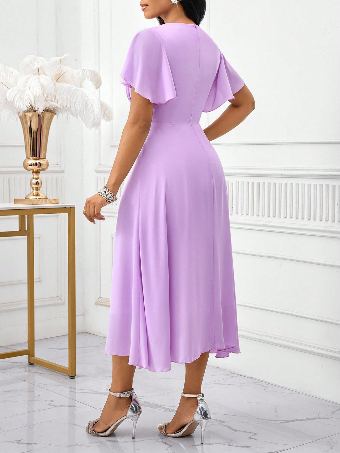 Step into summer celebrations with this Elegant Solid Color V-Neck Ruffle Sleeve Dress, designed to make you the star guest! Its playful ruffle sleeves add just the right flair, while the flattering V-neck keeps things chic and breezy. Perfectly tailored for weddings, this dress combines comfort with style so you can dance the night away with ease and grace.