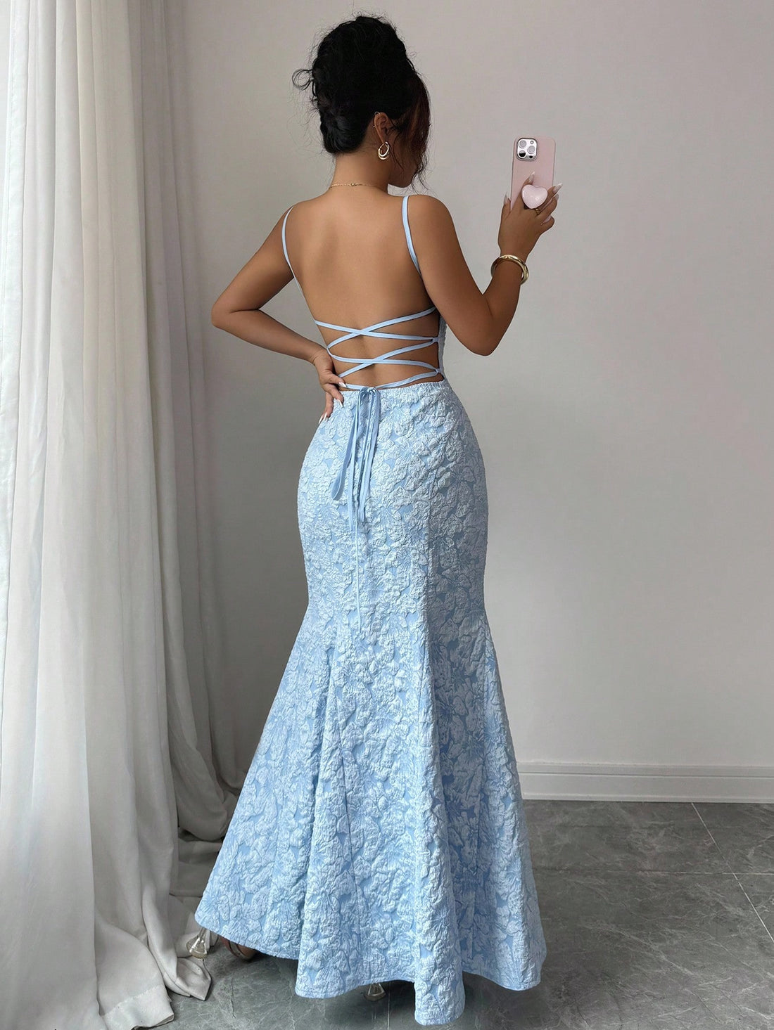 This playful blue floral satin fishtail halter gown brings a splash of summer elegance to any wedding or party. Its smooth satin finish and flattering fishtail silhouette highlight your curves while the halter neckline adds a flirty touch. Perfect for turning heads and dancing the night away with ease and style.