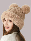 Side view of beige knit bear-ear hat with textured crown and fuzzy edge
