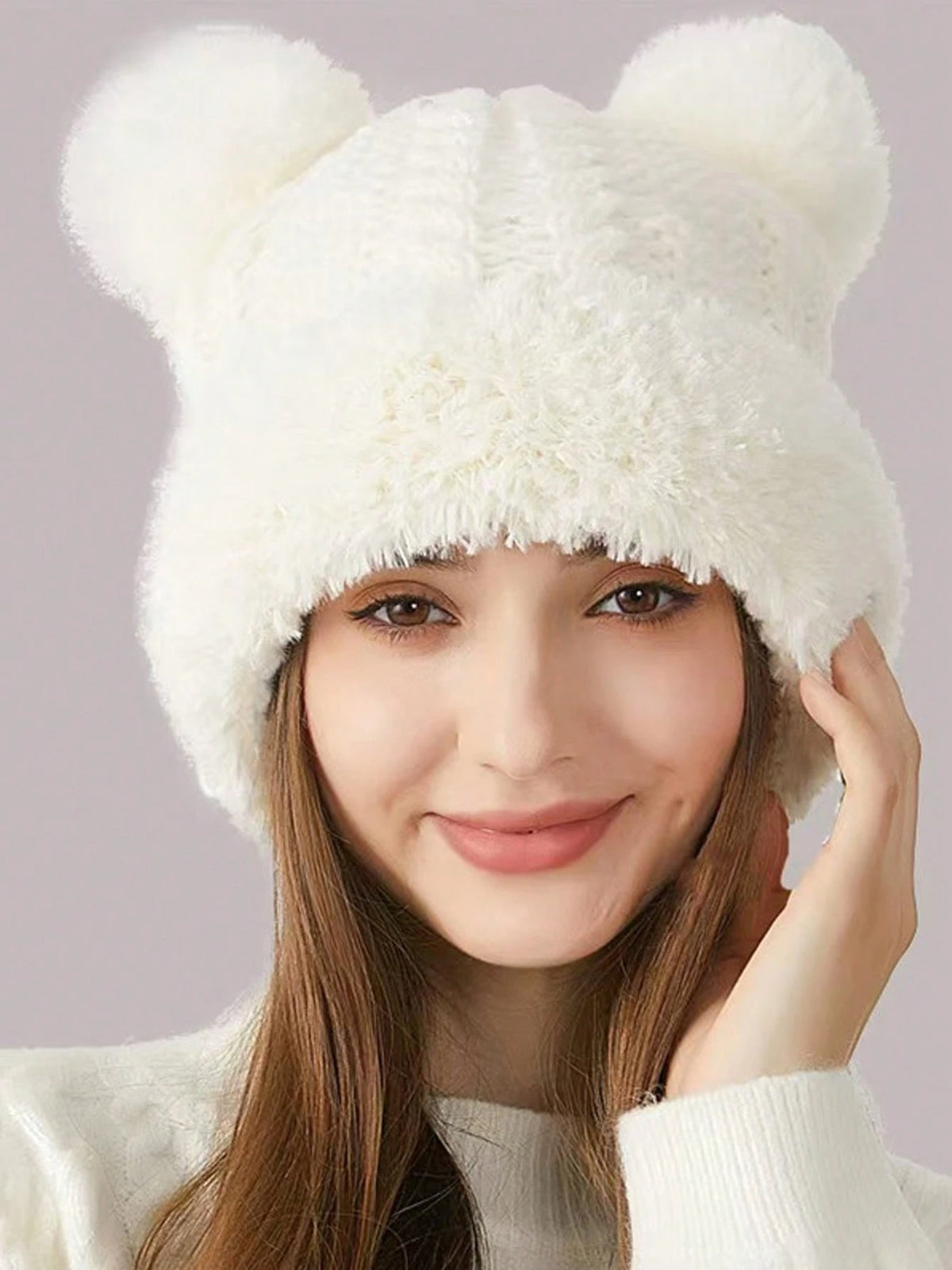 Front portrait showing ivory plush hat and paired bear-ear poms