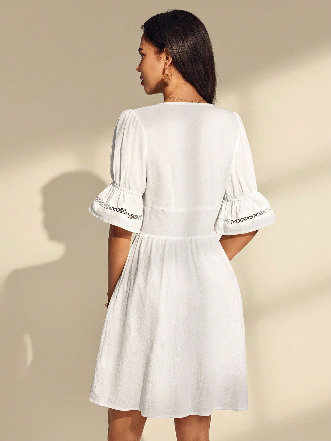 Twirl into summer with this stunning white lace mini dress that's equal parts romantic and chic. The delicate lace fabric creates an effortlessly elegant look, while the waist-cinching detail flatters your silhouette and adds a touch of sophistication. Perfect for garden parties, brunch dates, or any occasion where you want to feel absolutely fabulous. This versatile piece transitions seamlessly from day to night, making it a wardrobe essential for the season ahead.