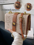 Tan trim retro square shoulder bag with structured flap body